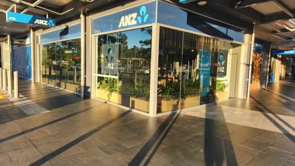 Commercial window tinting in Brisbane on an ANZ corner shopfront with reflective glass film by Glass Tinting Solutions