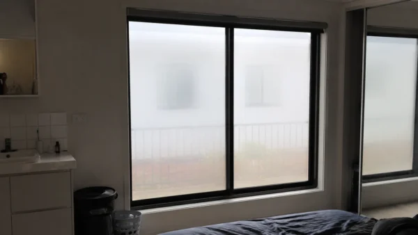 Frosted window film installed in a Brisbane apartment, providing privacy while allowing soft natural daylight into the room.