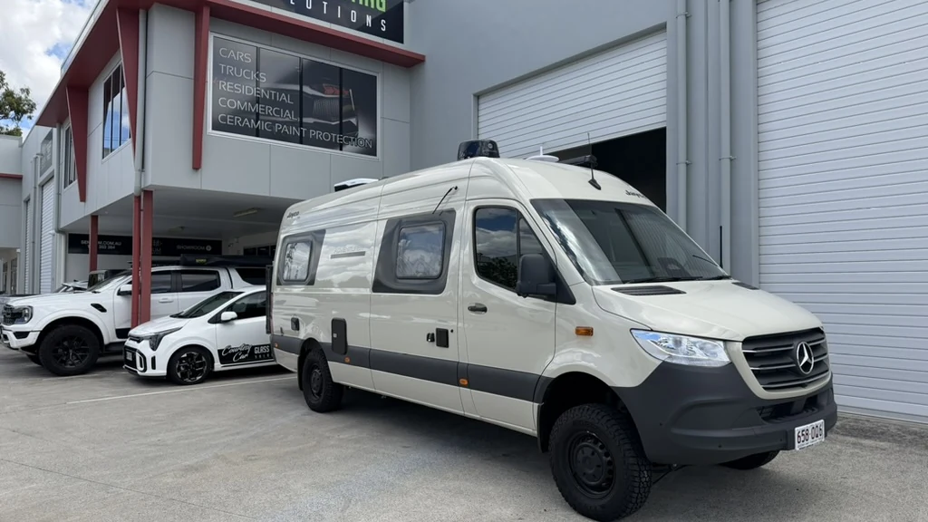 Mercedes Sprinter campervan with window tint, parked outside the GTS Glass Tinting Solutions shop