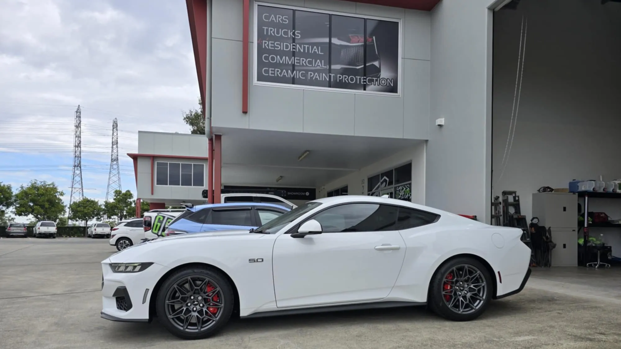 White Ford Mustang 5.0 sports car with tinted windows finished by GTS window tinting specialists
